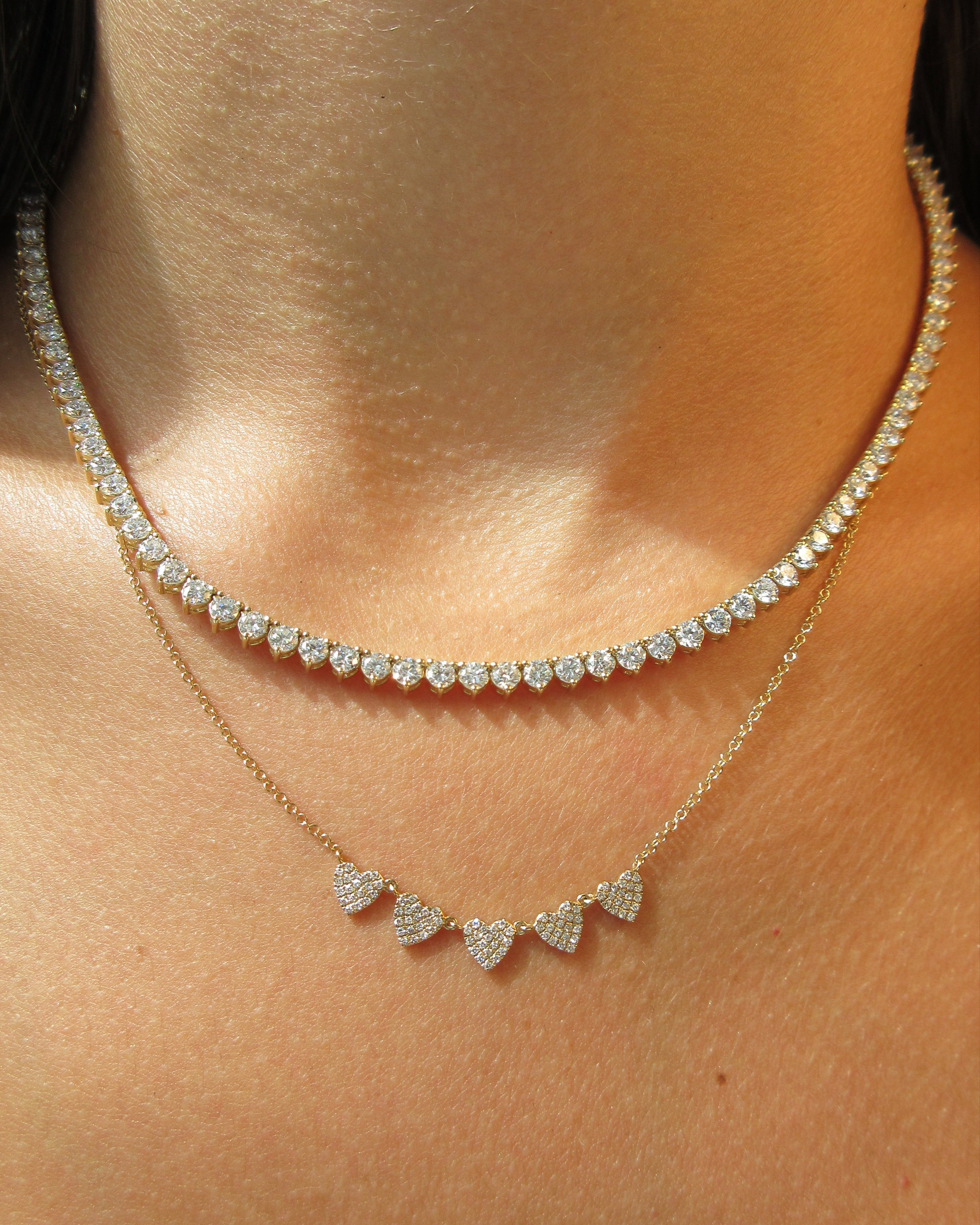 Close-up of a diamond necklace on a person's neck