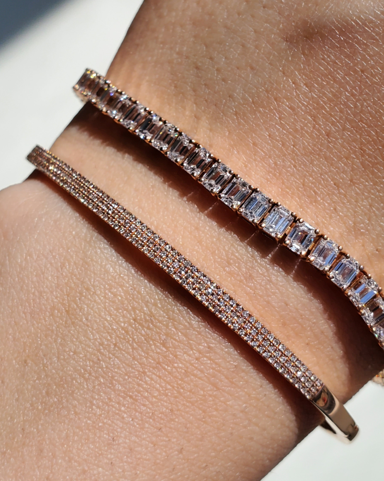 Rose gold pavé diamond bangle with natural diamonds on a model, showcasing timeless elegance and modern sophistication.