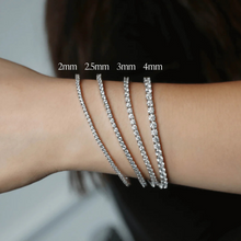 Load image into Gallery viewer, Classic LAB Bold Tennis Bracelet with 4 prong lab diamonds on model, blending timeless elegance and modern craftsmanship.
