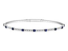 Load image into Gallery viewer, Blue sapphire and diamond bangle with natural diamonds on white background, showcasing timeless elegance and modern sophistication.
