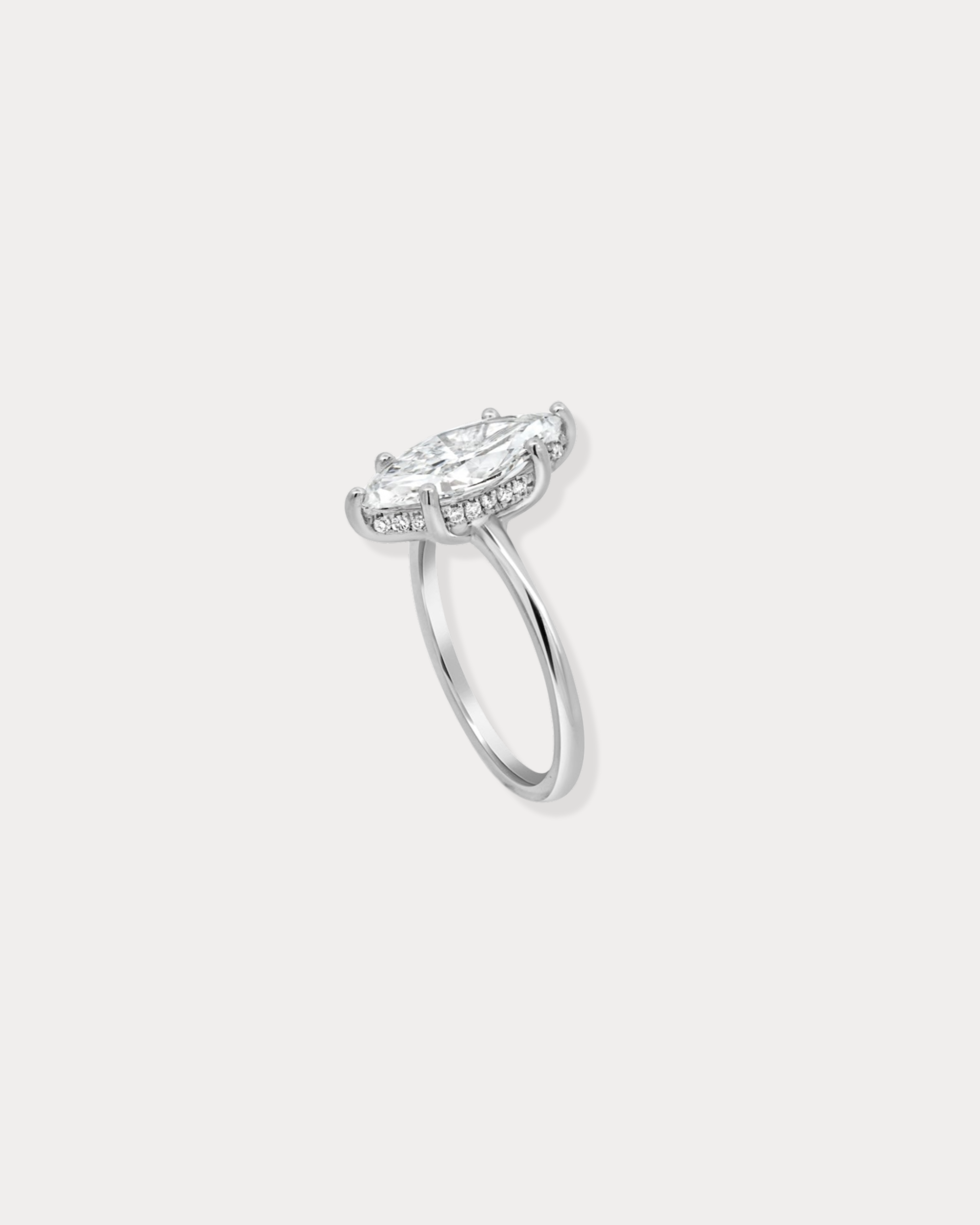 Marquise cut lab diamond engagement ring with hidden halo